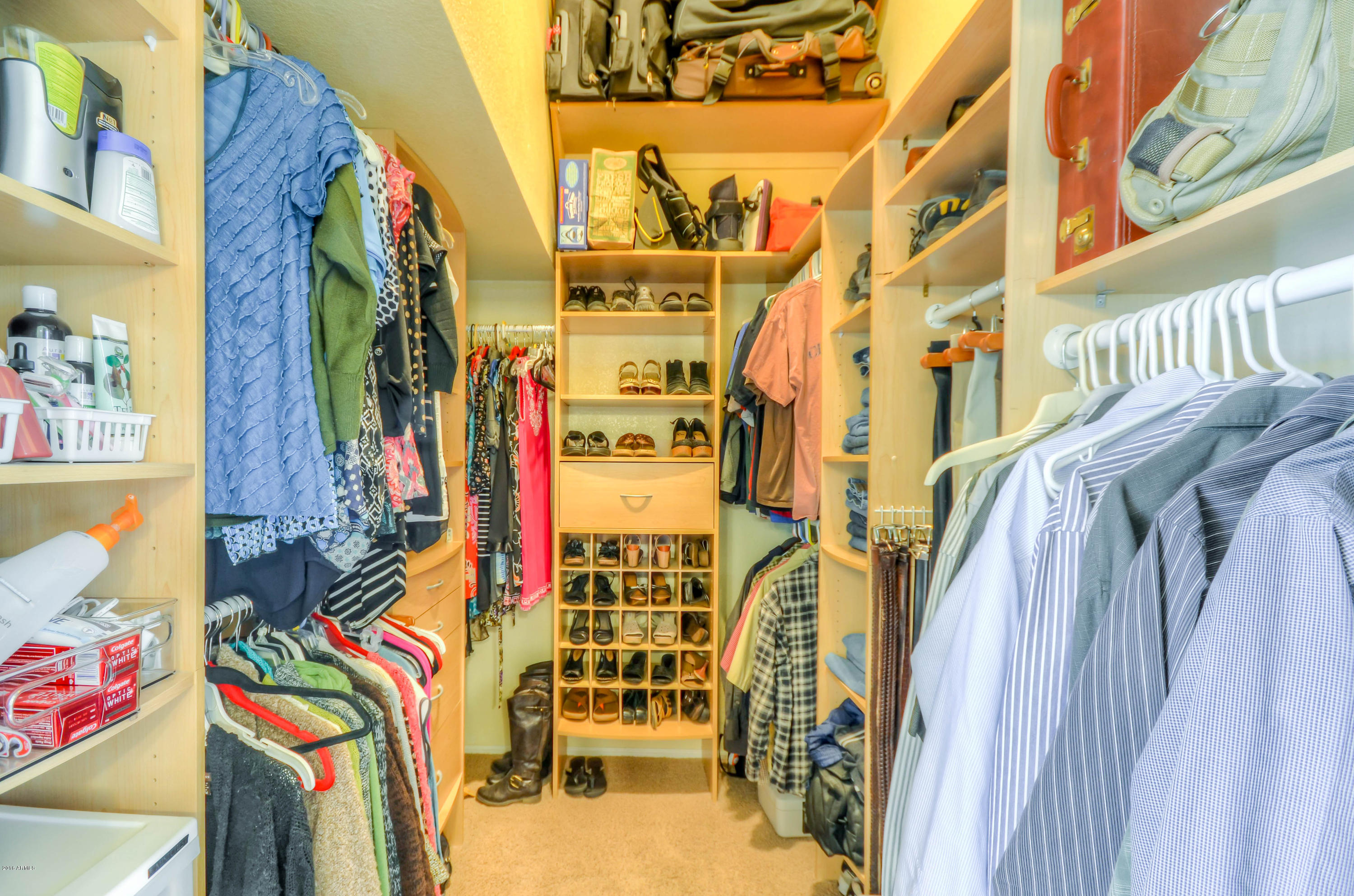 1433 North Woodside Road Chandler, AZ 85224 - Photo 37 of 70 a view of walk in closet with clothes