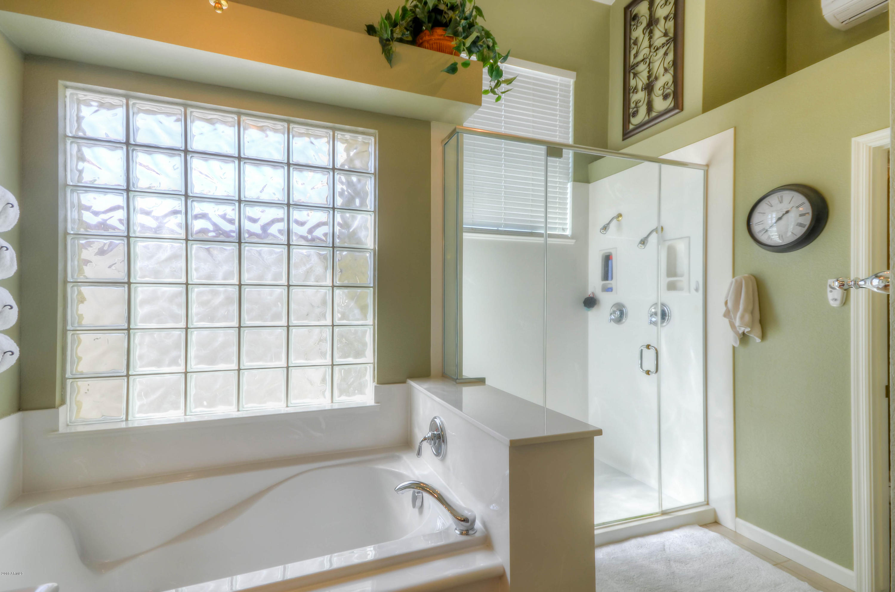 1433 North Woodside Road Chandler, AZ 85224 - Photo 39 of 70 a bathroom with a bathtub and a shower
