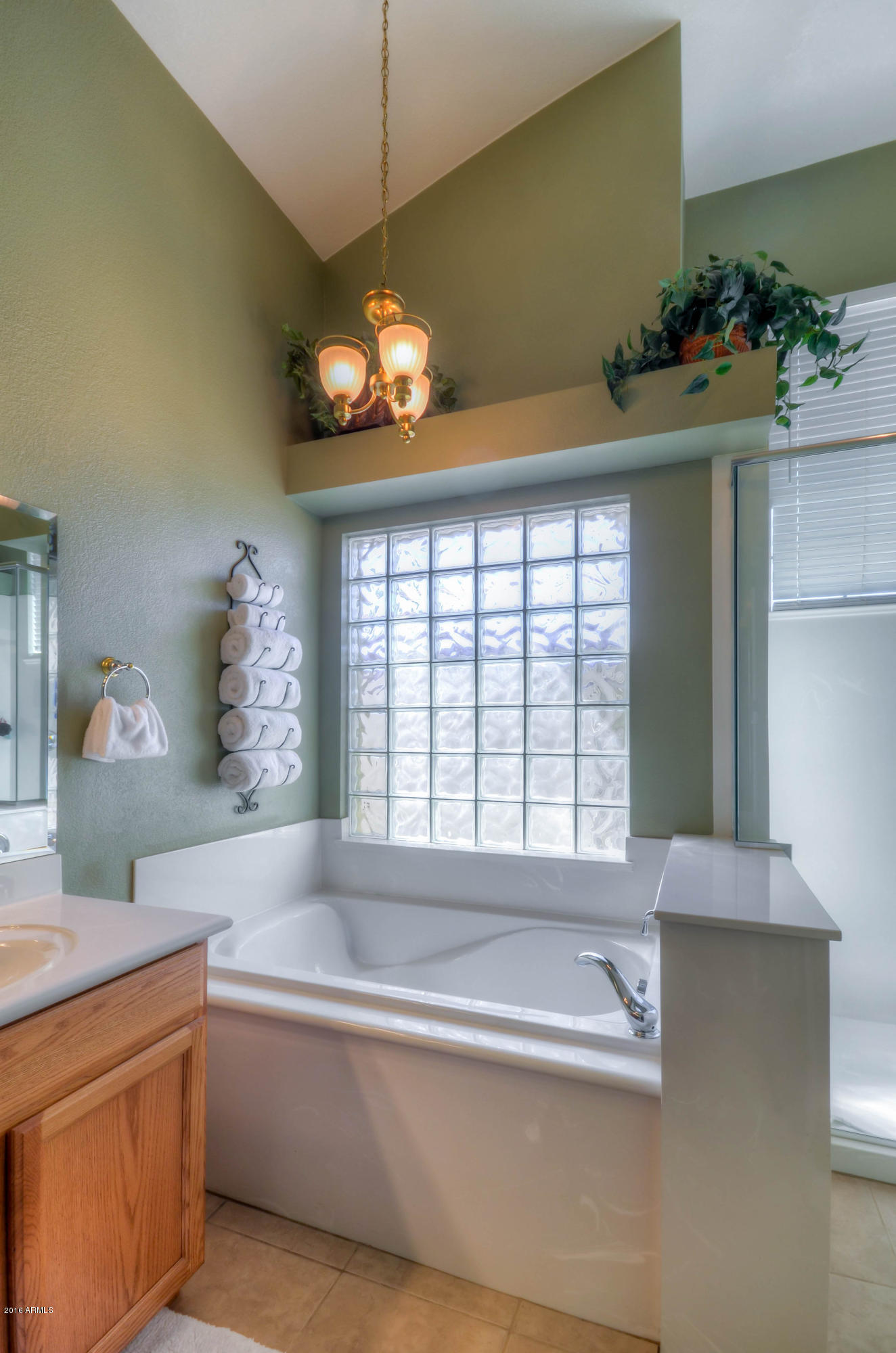 1433 North Woodside Road Chandler, AZ 85224 - Photo 41 of 70 a spacious bathroom with a granite countertop tub and a large window