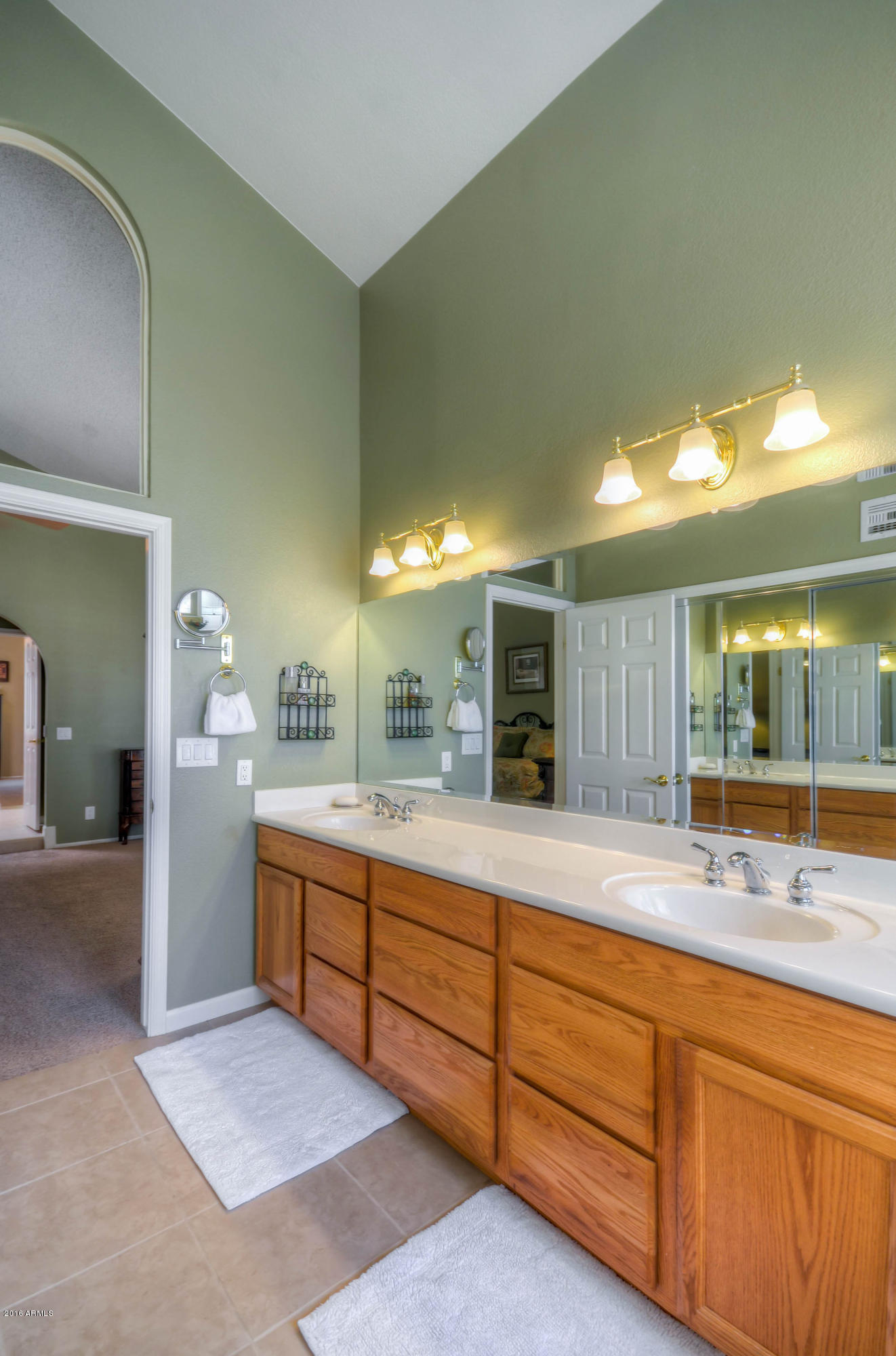 1433 North Woodside Road Chandler, AZ 85224 - Photo 42 of 70 a spacious bathroom with a granite countertop sink and a mirror