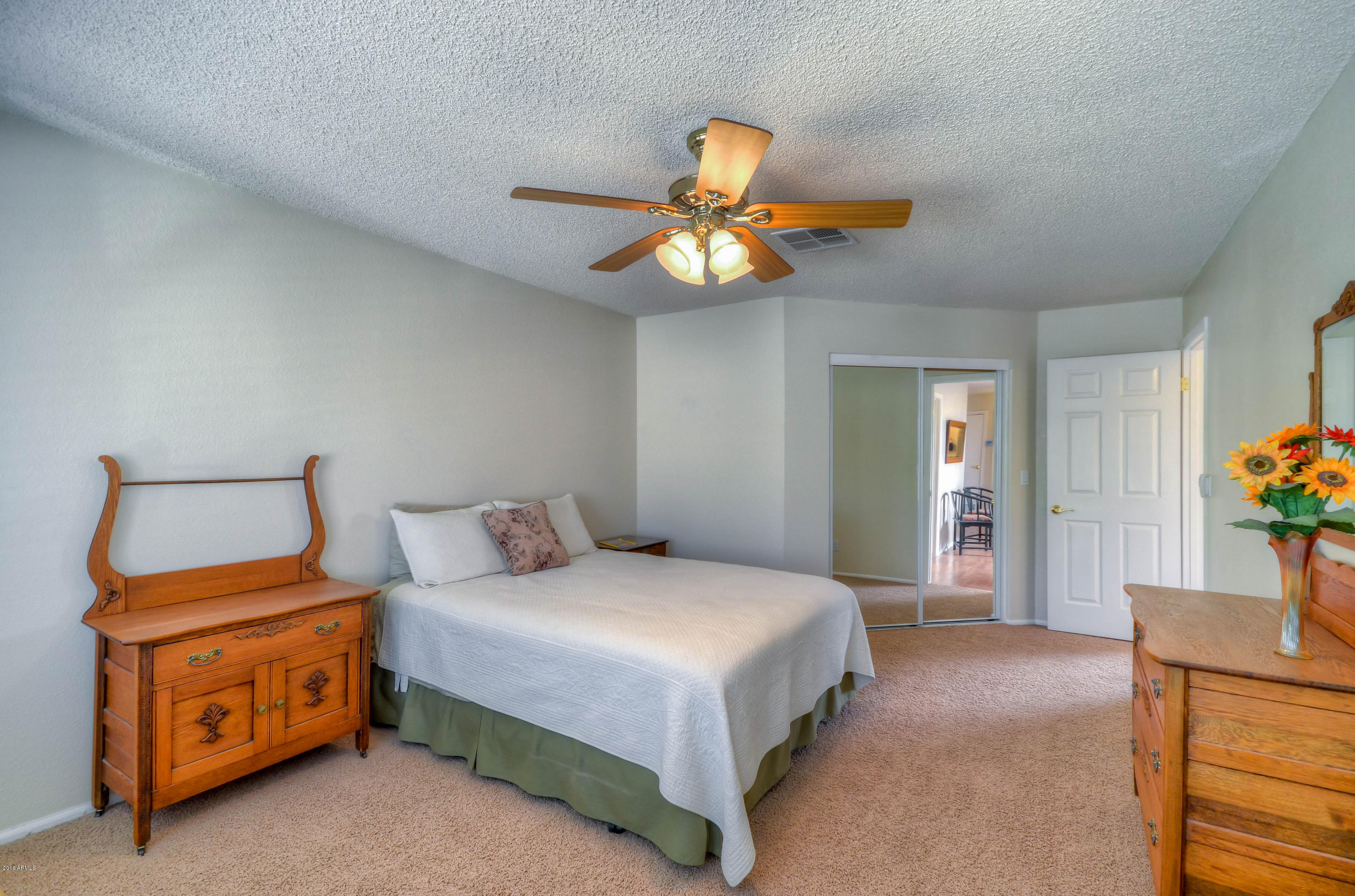 1433 North Woodside Road Chandler, AZ 85224 - Photo 48 of 70 a bedroom with a bed and a chandelier