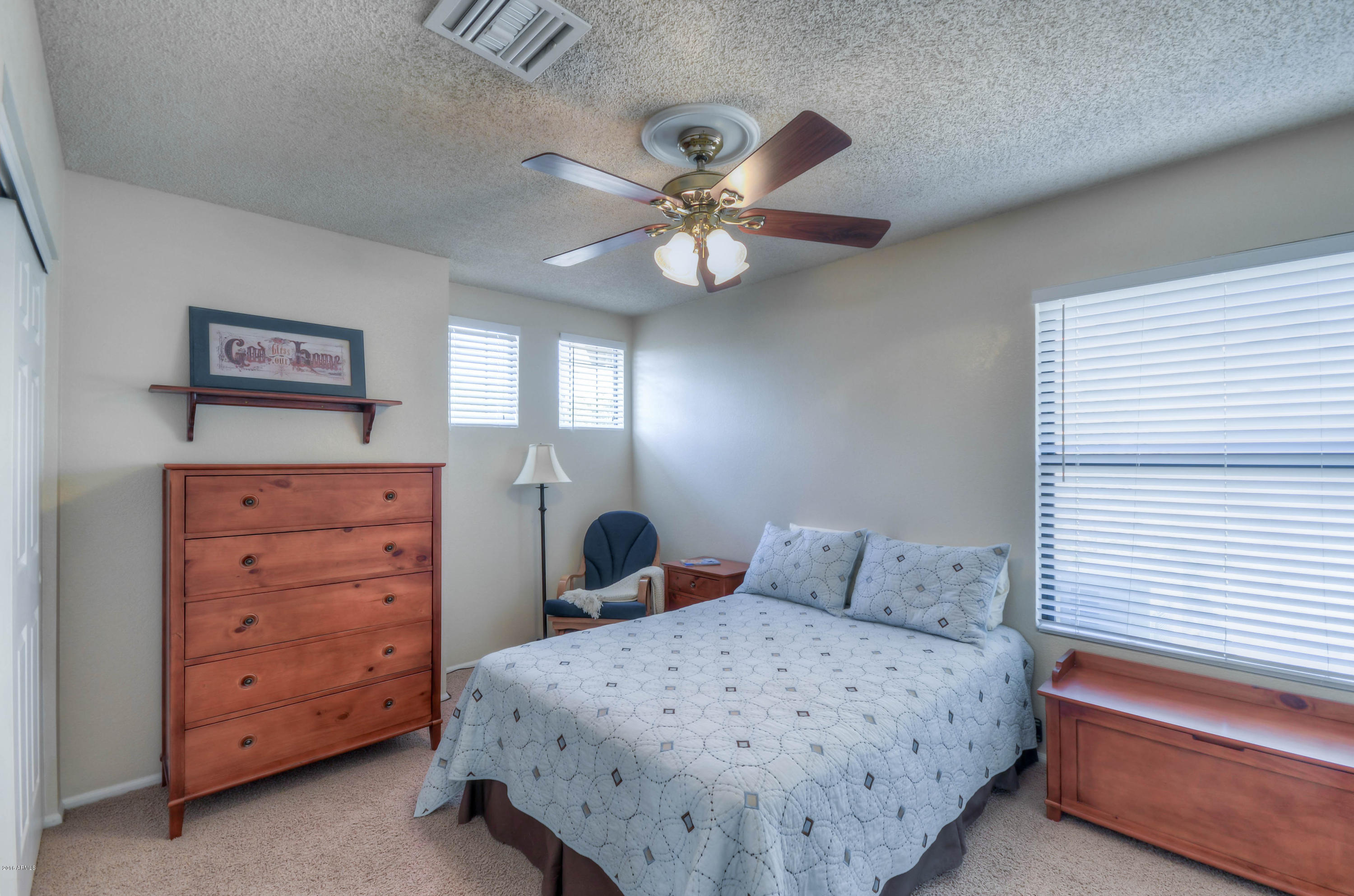 1433 North Woodside Road Chandler, AZ 85224 - Photo 51 of 70 a bedroom with a bed and a dresser