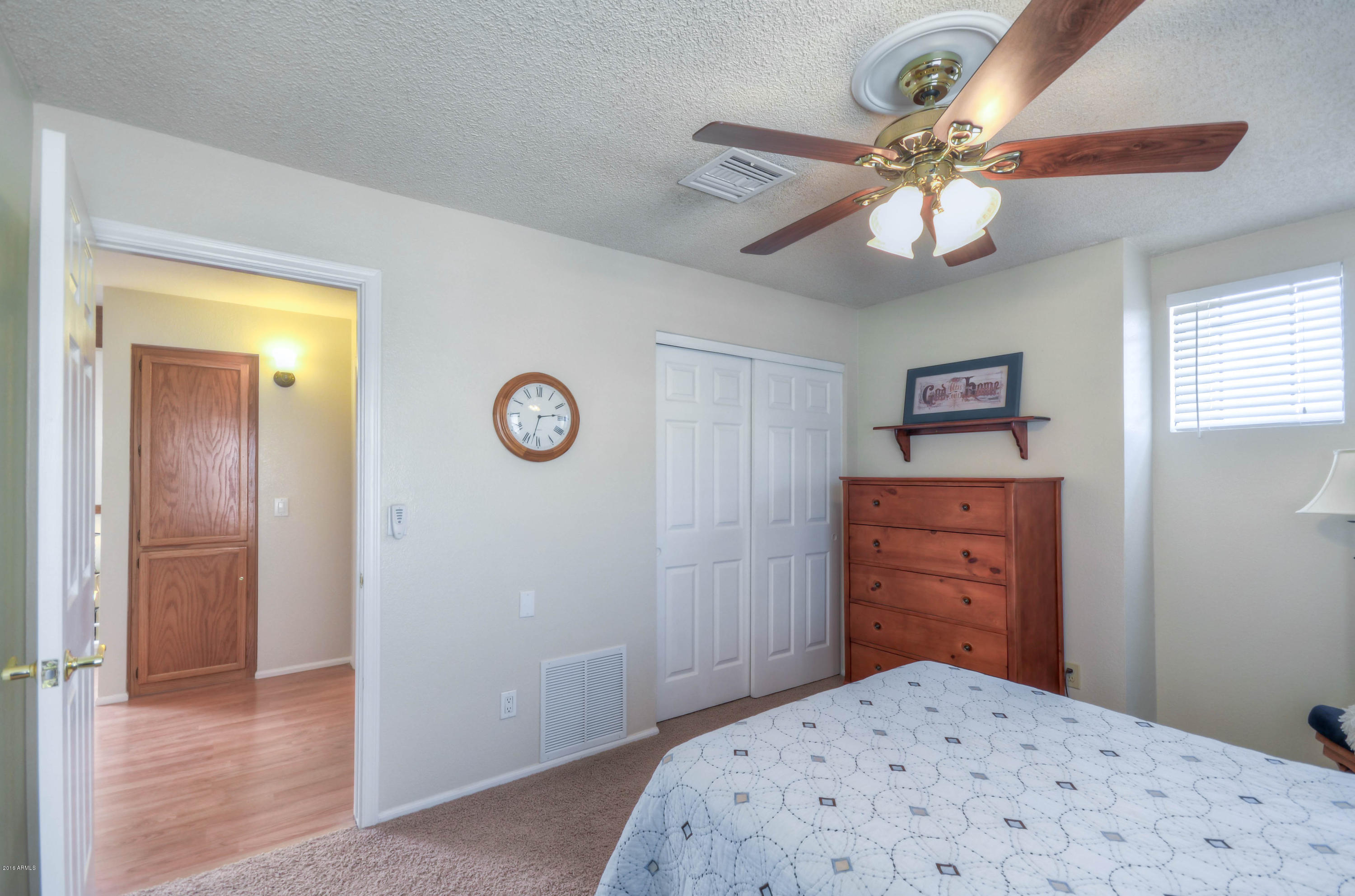 1433 North Woodside Road Chandler, AZ 85224 - Photo 52 of 70 a bedroom with a bed and a chandelier
