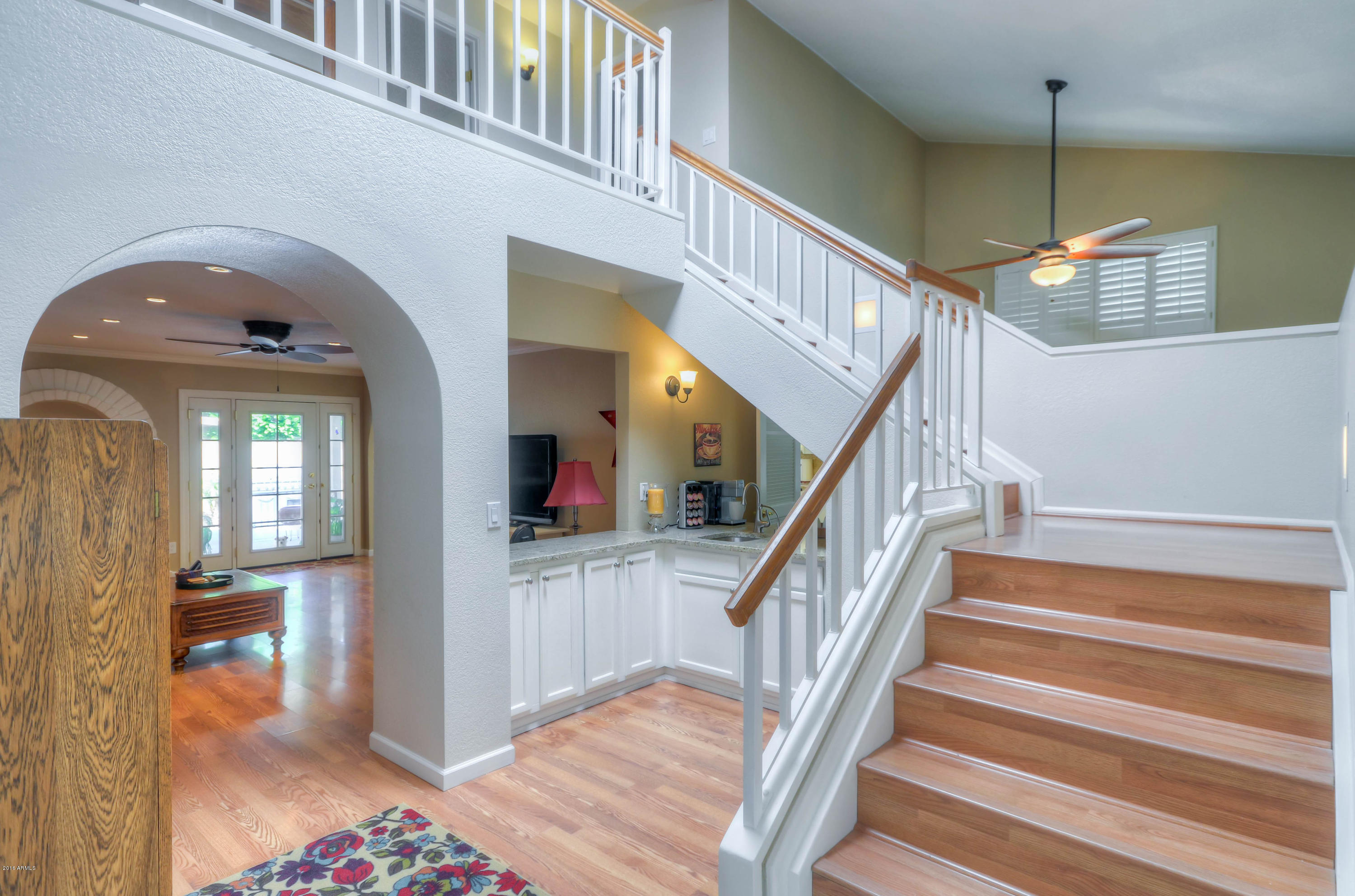 1433 North Woodside Road Chandler, AZ 85224 - Photo 6 of 70 a view of entryway and hall with wooden floor