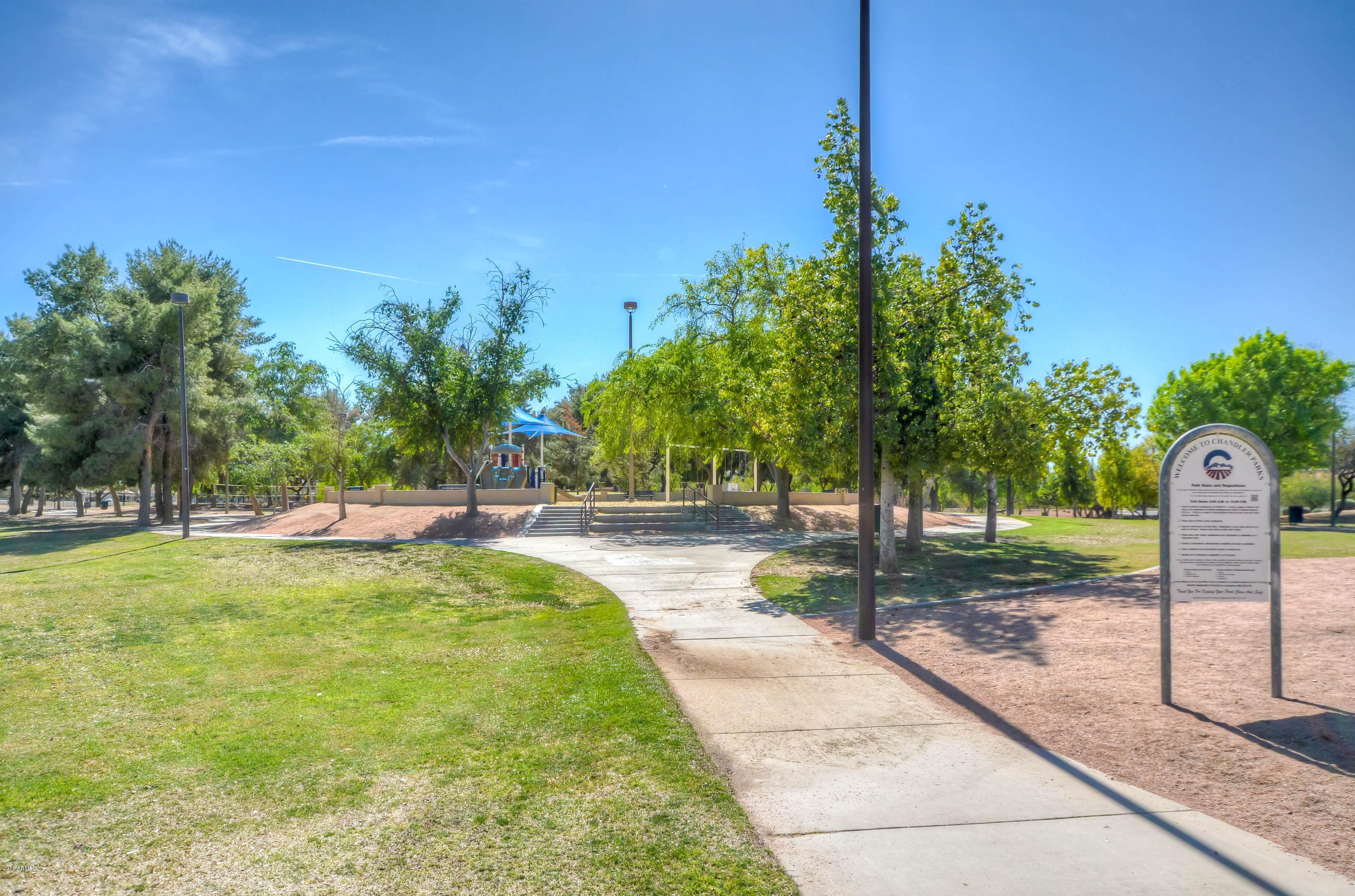 1433 North Woodside Road Chandler, AZ 85224 - Photo 66 of 70 a swimming pool with outdoor seating and yard