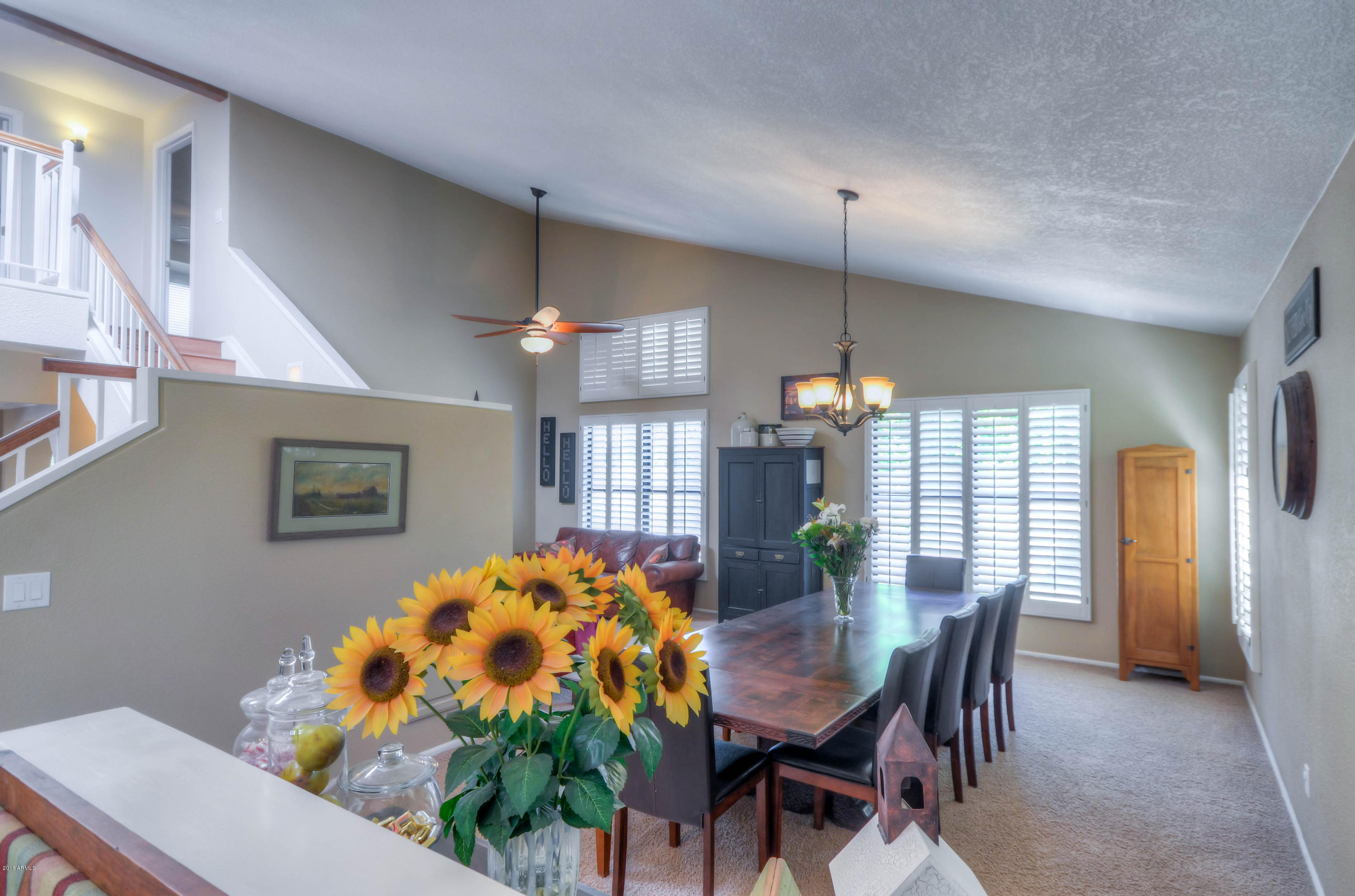 1433 North Woodside Road Chandler, AZ 85224 - Photo 9 of 70 a view of a dining room with furniture and chandelier