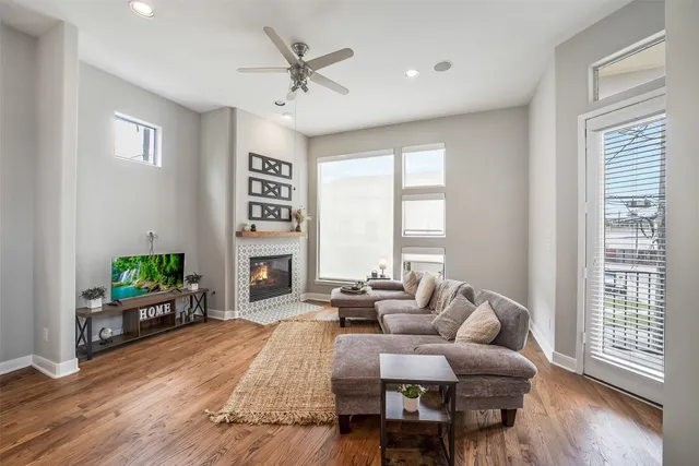 a living room with furniture and a fireplace