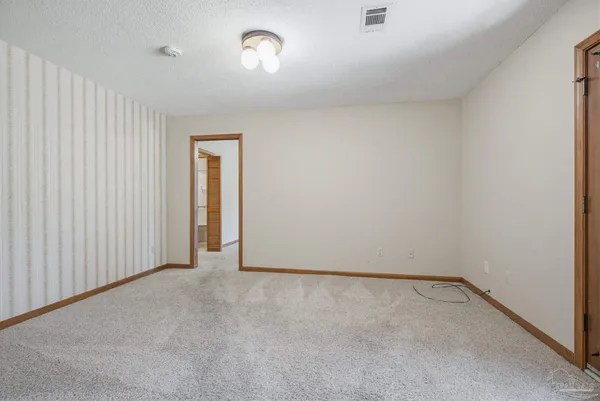 a view of an empty room and closet