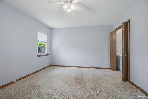 a en suite bathroom with a sink and a mirror