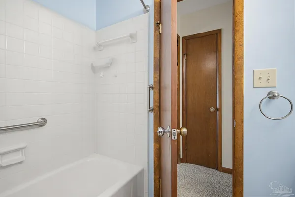 a view of backyard with tub and trees