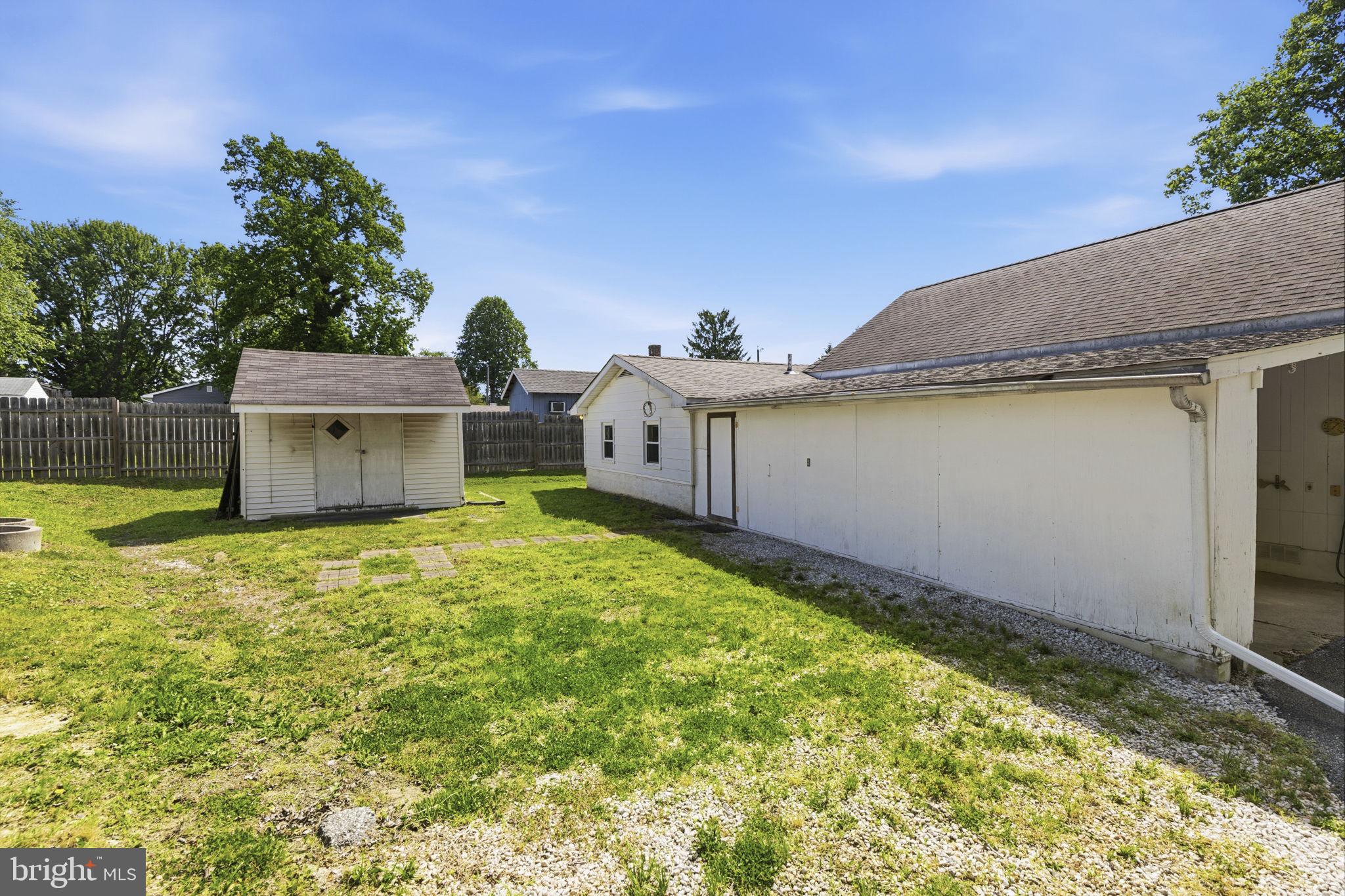 2411 Poplar Road Baltimore, MD 21221 - Photo 28 of 36 a view of a house with a backyard and a tub