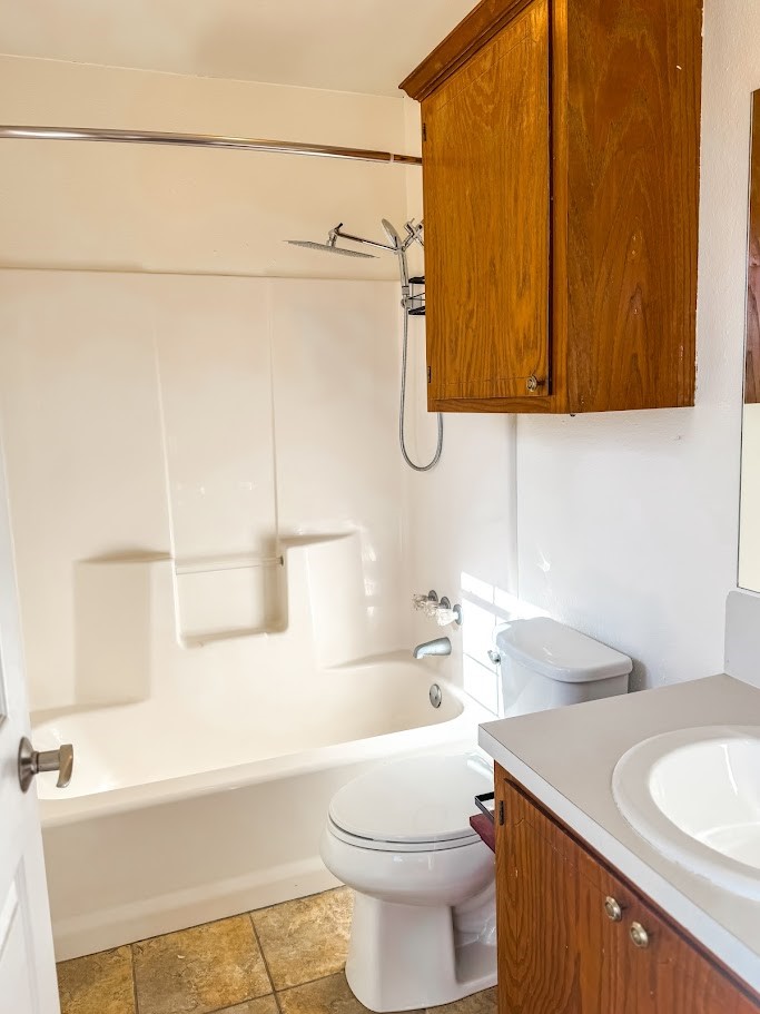 2010 Salt Works Road Palestine, TX 75803 - Photo 11 of 23 a bathroom with a sink a toilet and shower