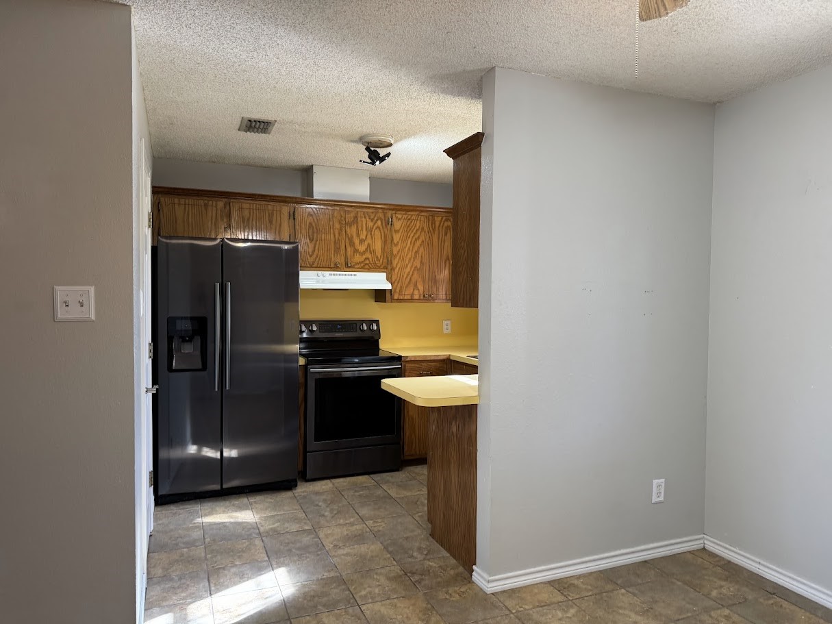 2010 Salt Works Road Palestine, TX 75803 - Photo 6 of 23 a kitchen with a refrigerator and a sink