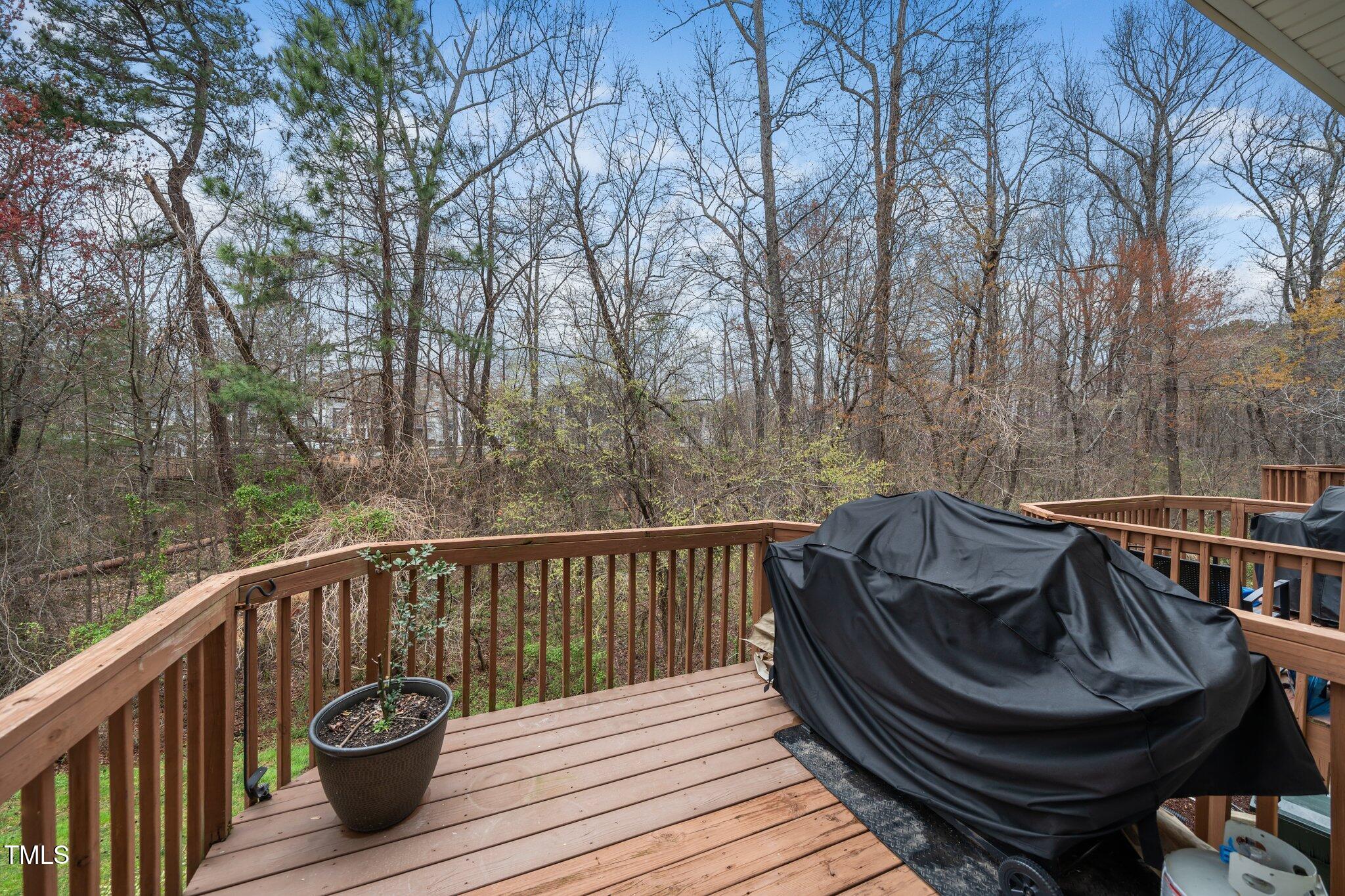 7753 Winners Edge Street Raleigh, NC 27617 - Photo 19 of 46 a view of balcony with furniture and wooden deck