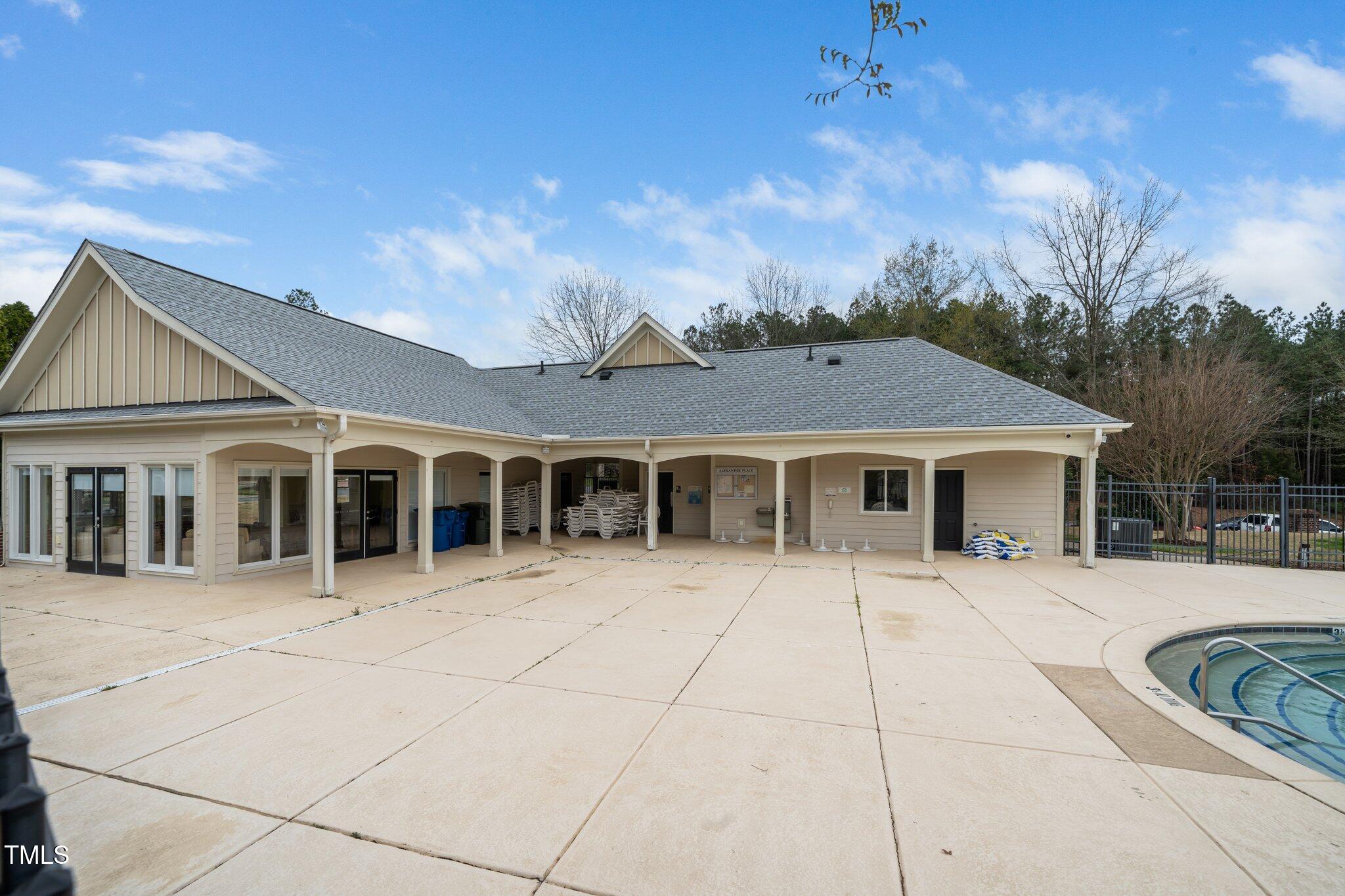 7753 Winners Edge Street Raleigh, NC 27617 - Photo 42 of 46 a front view of a house with a yard and trees
