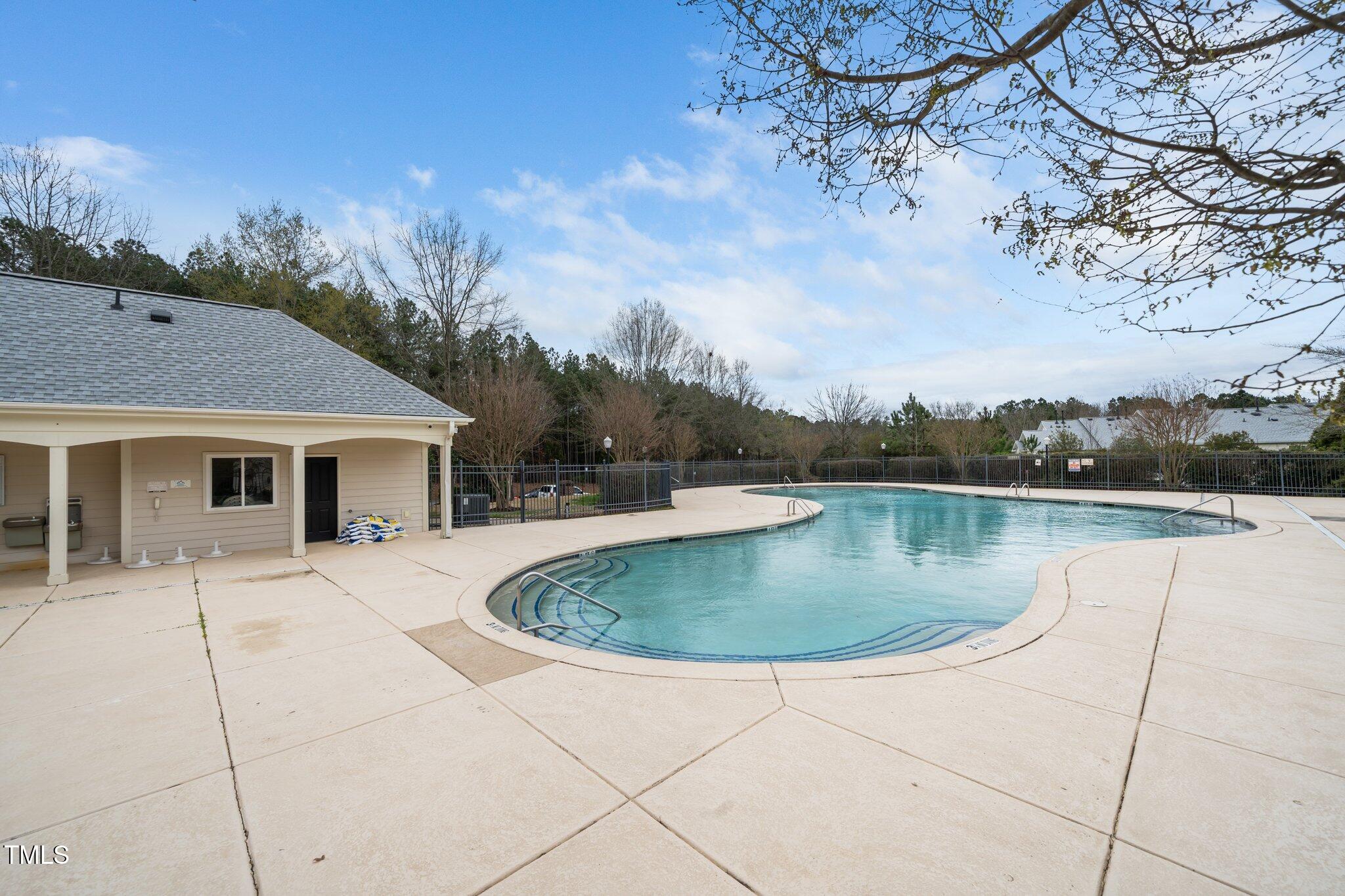 7753 Winners Edge Street Raleigh, NC 27617 - Photo 44 of 46 a view of a house with pool and a yard