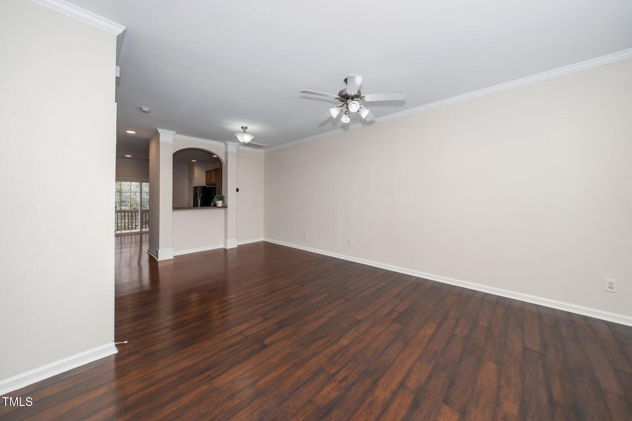 7753 Winners Edge Street Raleigh, NC 27617 - Photo 8 of 46 a view of empty room with wooden floor