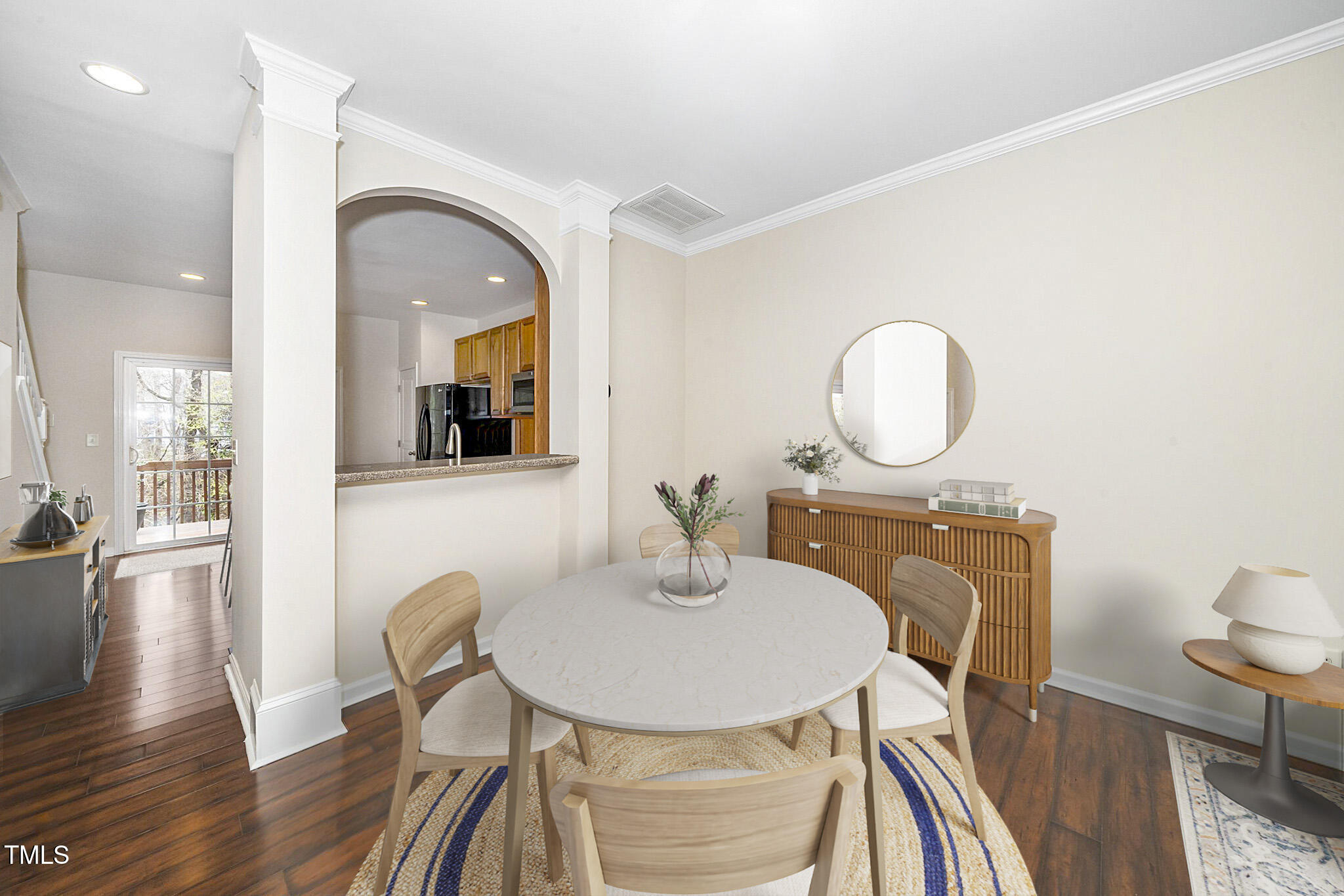 7753 Winners Edge Street Raleigh, NC 27617 - Photo 9 of 46 a view of a dining room with furniture and wooden floor