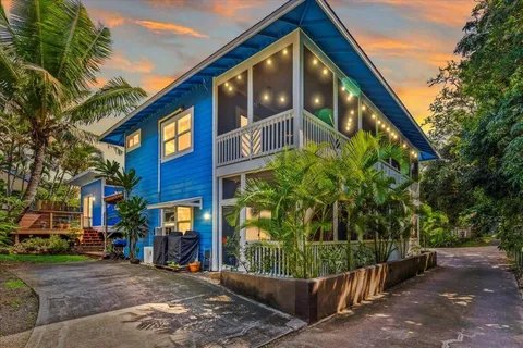 a bed room with a bed window and a chair