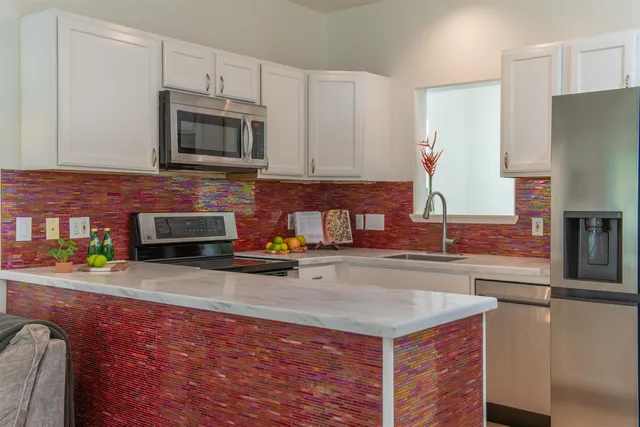 a view of two chairs in the balcony