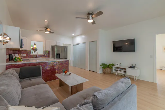 a bedroom with a bed and a couch