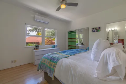 a balcony with wooden floor and outdoor seating