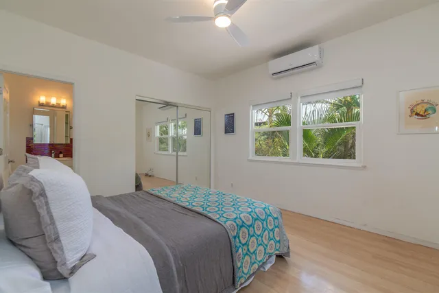 a view of a house with a small yard and sitting area