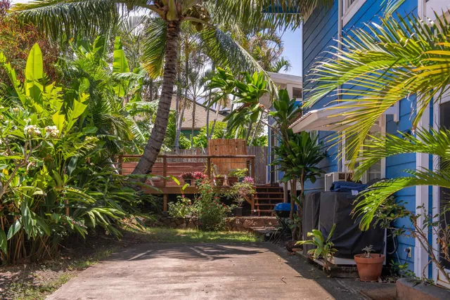 a view of a wooden bench in front of a house