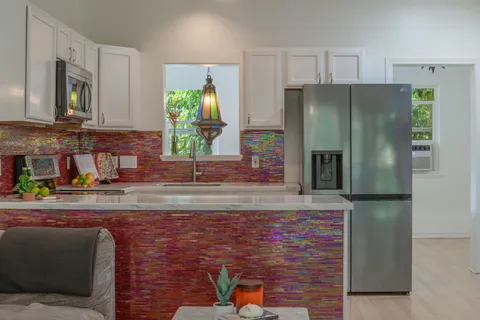 a view of an outside dining space with furniture window and outside view