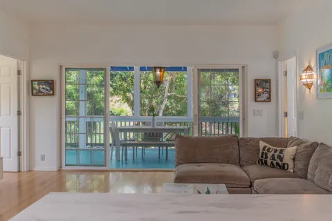 a kitchen with stainless steel appliances granite countertop a refrigerator and a stove
