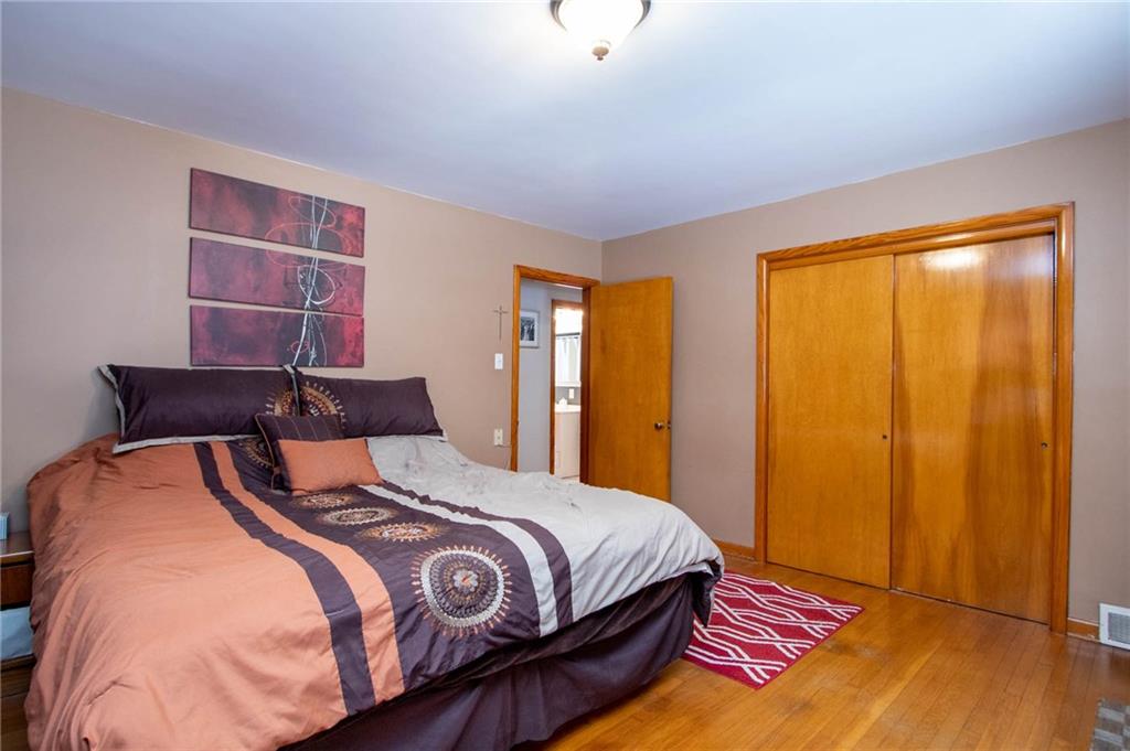 627 Virginia Avenue Rochester, PA 15074 - Photo 7 of 17 This picture does not do the size of this room justice. Very large master bedroom with hardwood flooring and large closet.