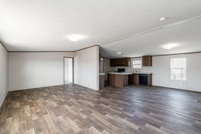 a kitchen with stainless steel appliances a refrigerator and a sink
