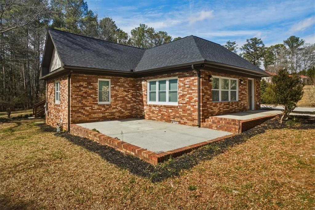 4911 Lower Jersey Road Oxford, GA 30054 - Photo 36 of 56 a front view of a house with a yard