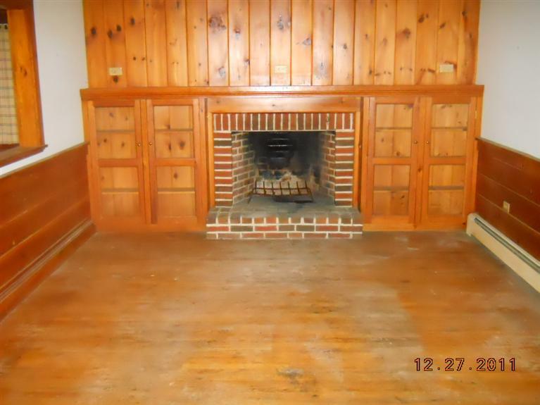 11 Shannon Road Harwich, MA 02645 - Photo 3 of 8 a view of a fireplace with an empty room