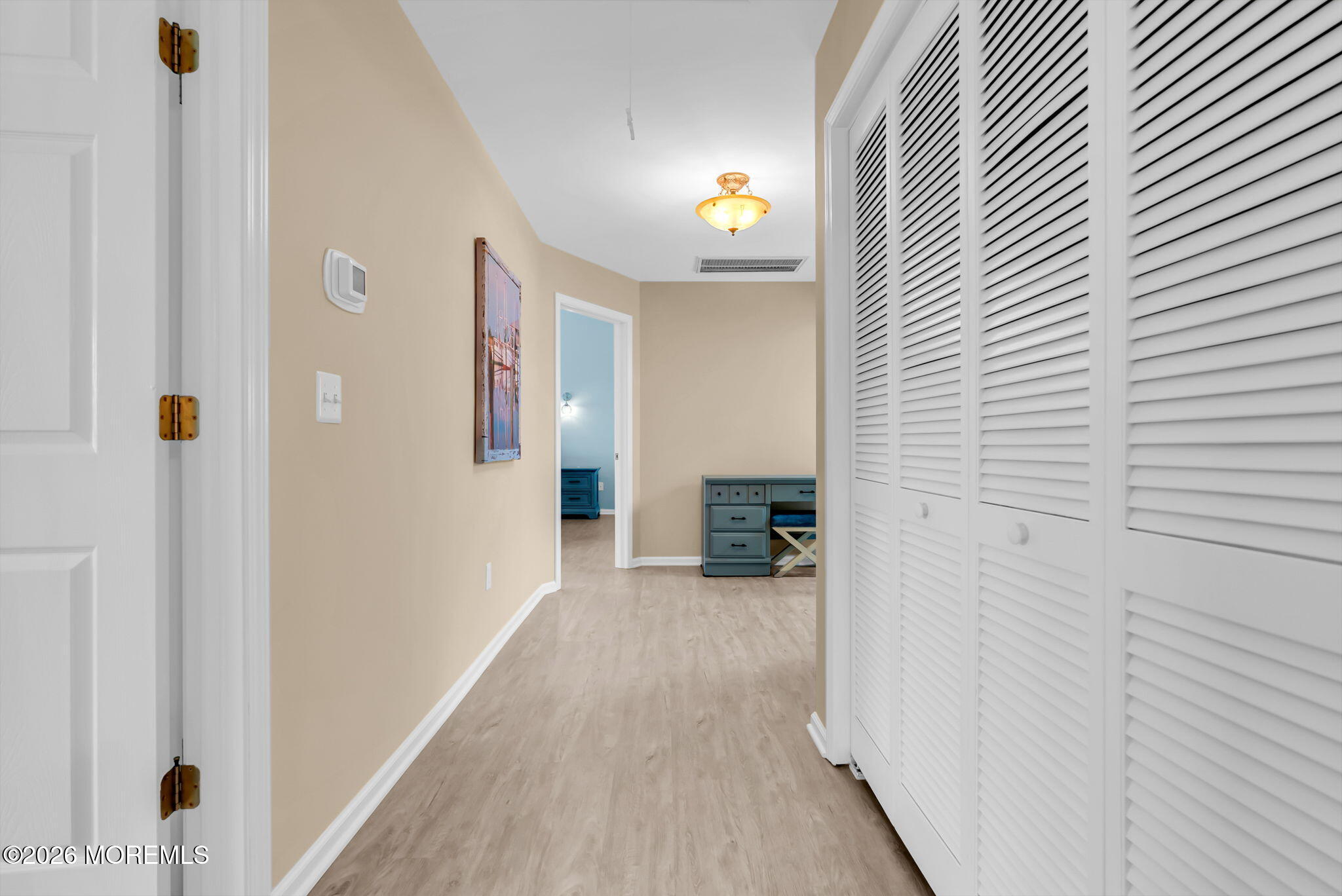9 Cross Trees Road Brick, NJ 08723 - Photo 63 of 126 a view of a hallway with wooden floor and staircase