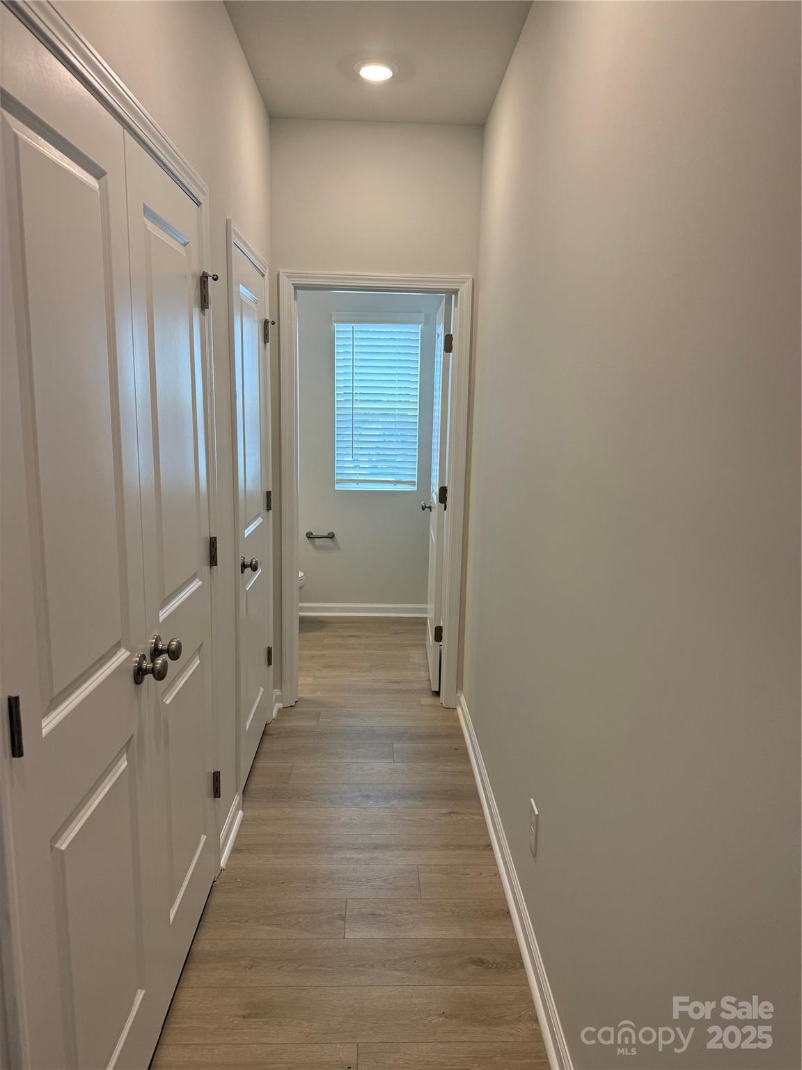 5821 Tuckaseegee Road Charlotte, NC 28208 - Photo 5 of 9 a view of a hallway with wooden floor and staircase