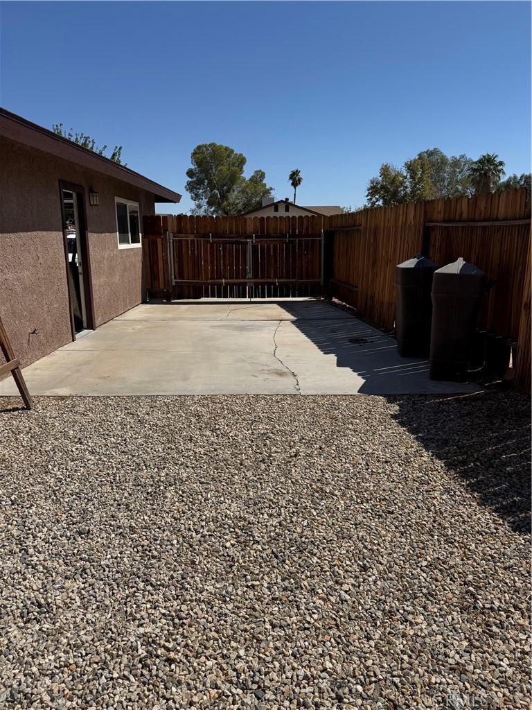 209 Kimberly Lane Ridgecrest, CA 93555 - Photo 13 of 62 a view of a backyard