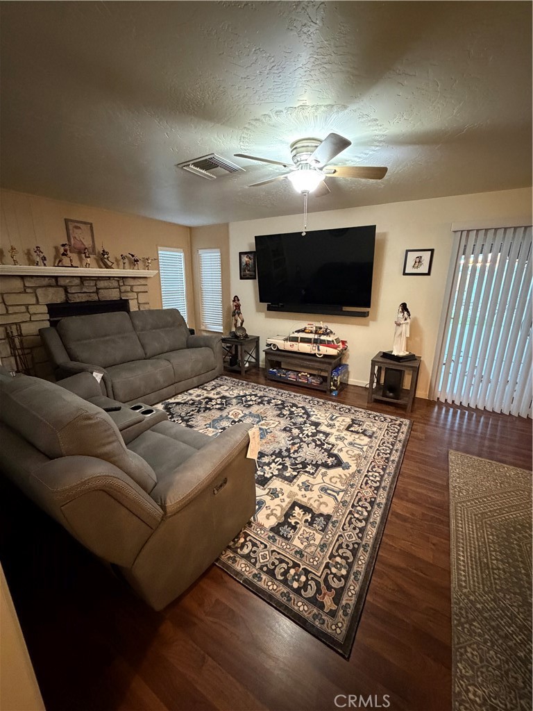 209 Kimberly Lane Ridgecrest, CA 93555 - Photo 23 of 62 a living room with furniture and a flat screen tv