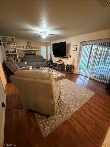 a bedroom with bed and a ceiling fan