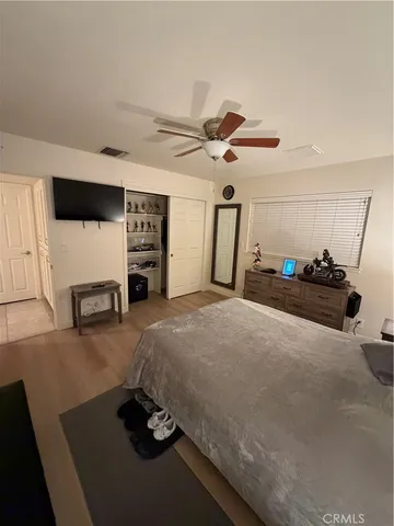 a view of a hallway and a livingroom with furniture