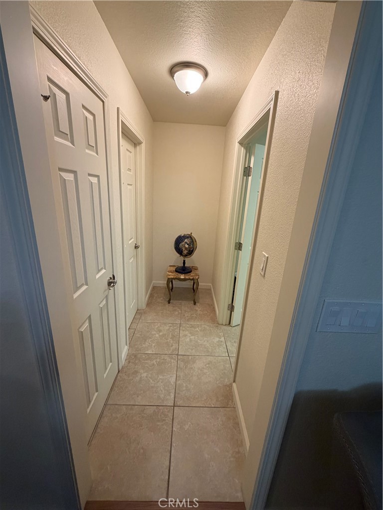 209 Kimberly Lane Ridgecrest, CA 93555 - Photo 33 of 62 a view of a hallway and a livingroom with furniture