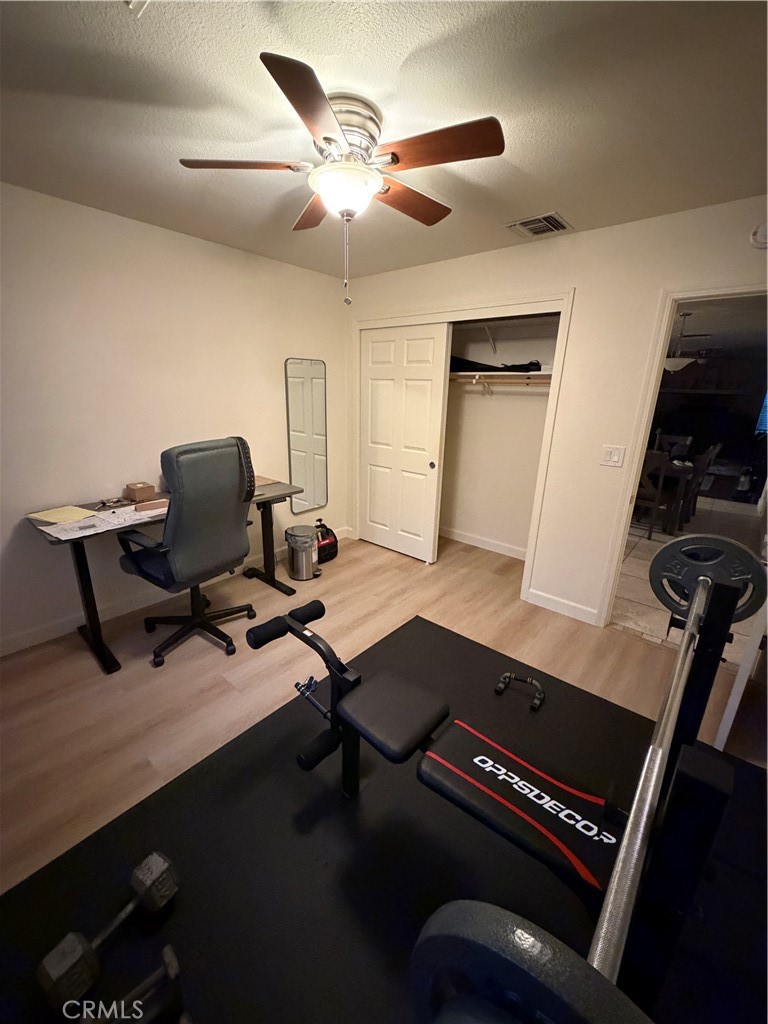 209 Kimberly Lane Ridgecrest, CA 93555 - Photo 39 of 62 a view of a workspace with furniture and a window