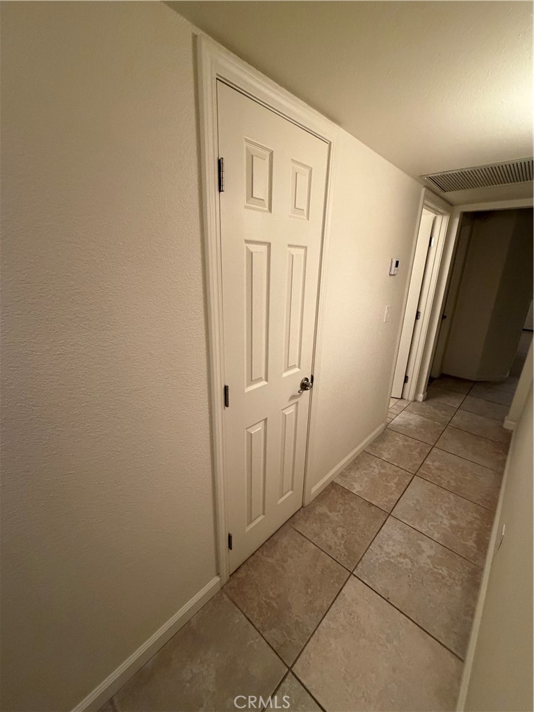 209 Kimberly Lane Ridgecrest, CA 93555 - Photo 45 of 62 a view of a hallway with wooden floor and closet area