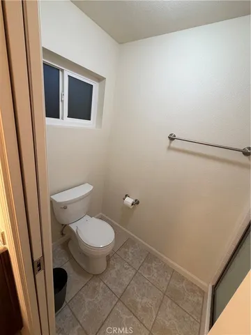 a room with a cabinets and window