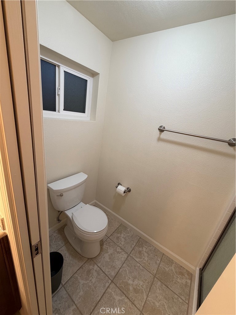 209 Kimberly Lane Ridgecrest, CA 93555 - Photo 49 of 62 a bathroom with a toilet and a sink
