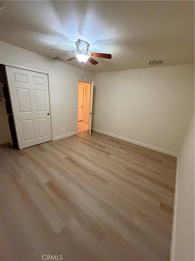 209 Kimberly Lane Ridgecrest, CA 93555 - Photo 57 of 62 a view of an empty room with a chandelier fan