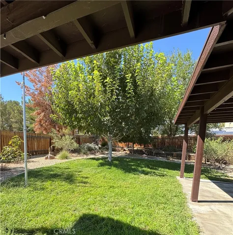 a view of a backyard with a sitting area