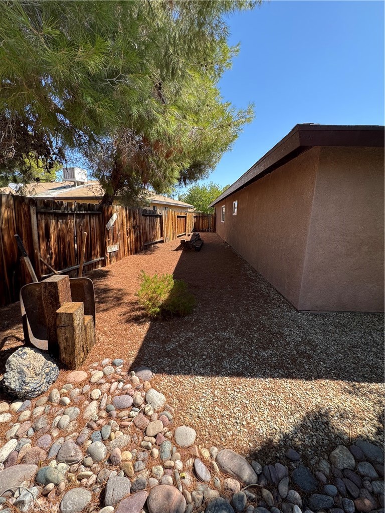 209 Kimberly Lane Ridgecrest, CA 93555 - Photo 10 of 62 a view of a backyard with a sitting area