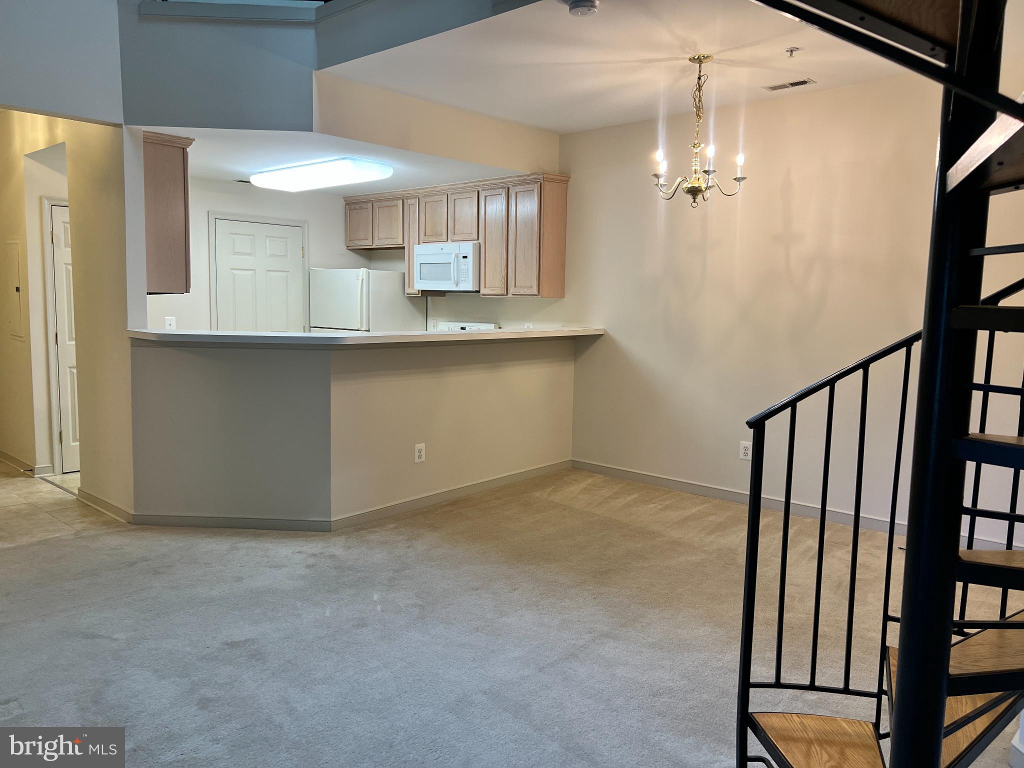 805 Latchmere Court, Unit 302 Annapolis, MD 21401 - Photo 2 of 14 a view of a kitchen from the hallway