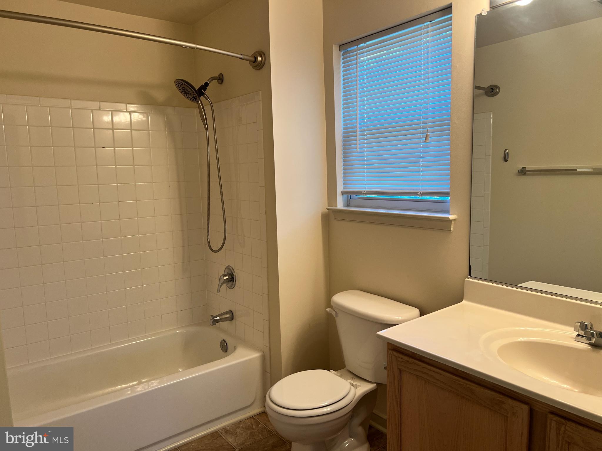 805 Latchmere Court, Unit 302 Annapolis, MD 21401 - Photo 5 of 14 a bathroom with a sink a toilet and shower